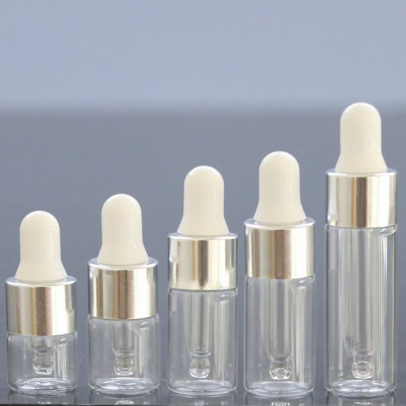1ml una pieza 3528; botella transparente con anillo de plata; vidrio