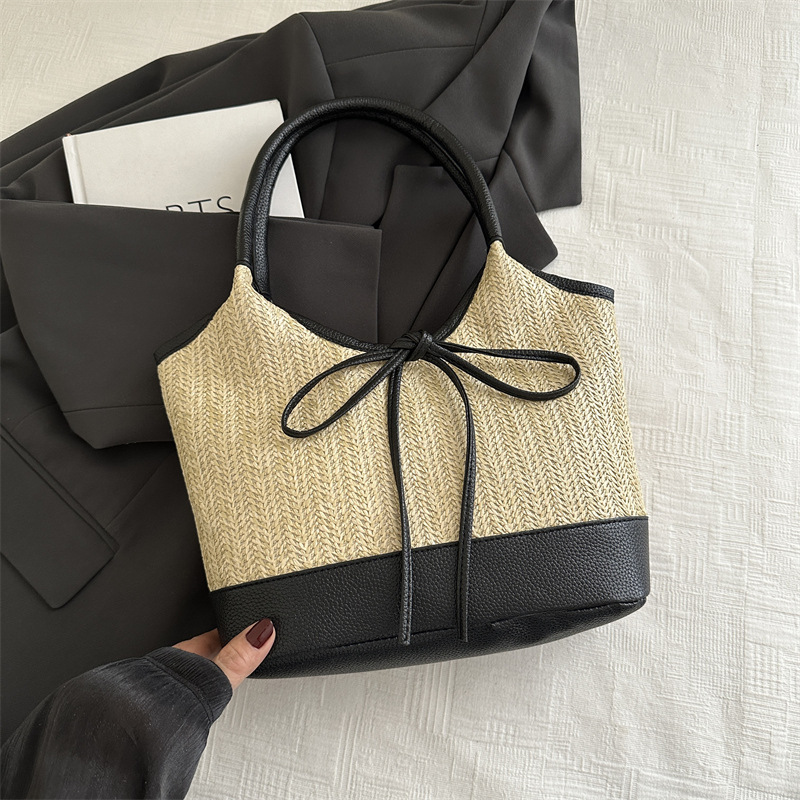Verano 2025 bowknot axila bolso femenino moda casual bolso de mano de gran capacidad bolso de hombro de color de contraste de paja de nicho