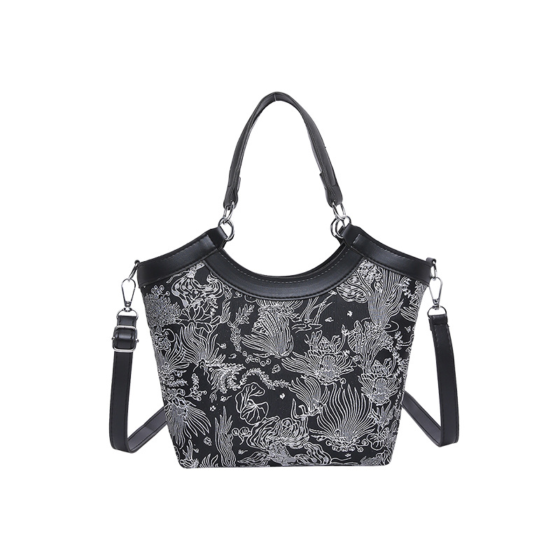 Nueva bolsa de mano de estilo chino para mujeres 2025 primavera nueva seda bordada de hombro único bolso de cubo de estilo occidental