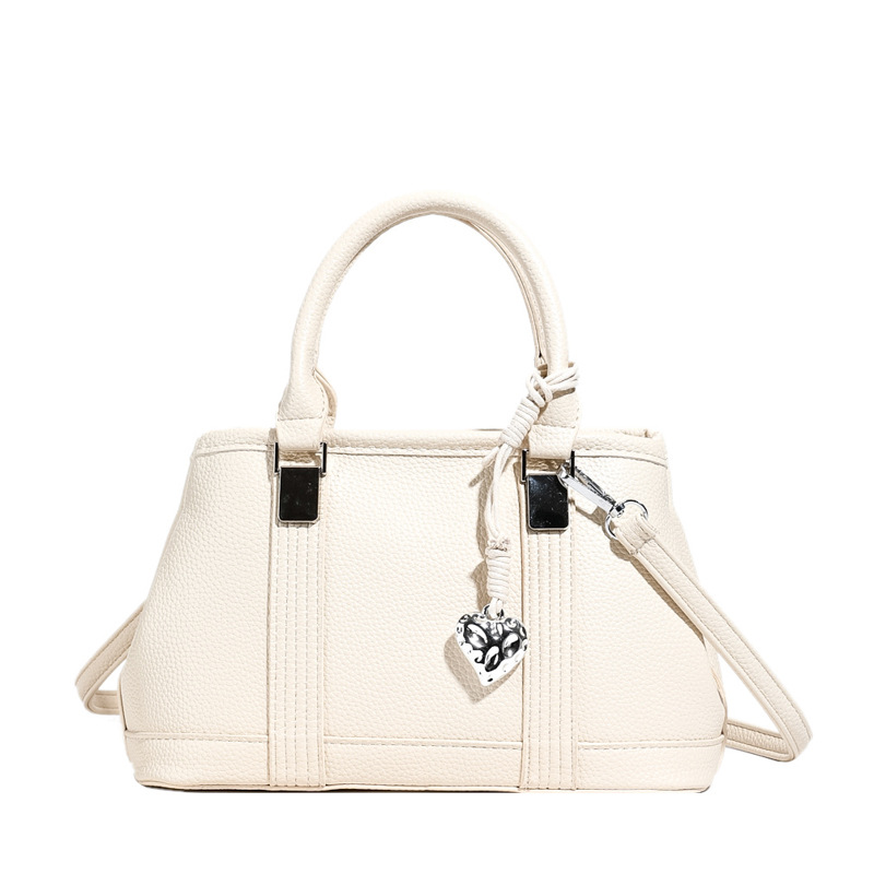 Versión coreana del bolso de nicho 2025 verano nuevo bolso femenino retro patrón de lichi bolso de hombro diario mensajero de viaje