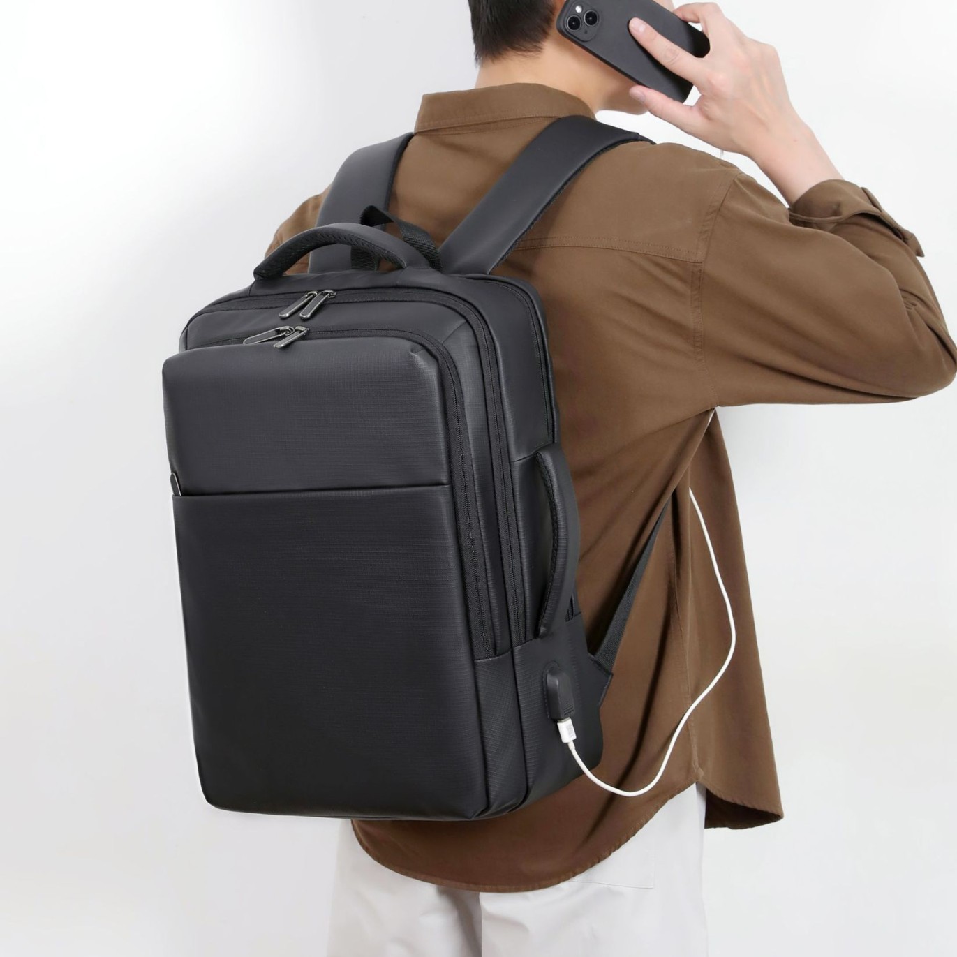 Mochila de alta calidad para hombre 2025 nuevo bolso de computadora de viaje de negocios de boca USB de color sólido simple mochila de negocios de gran capacidad