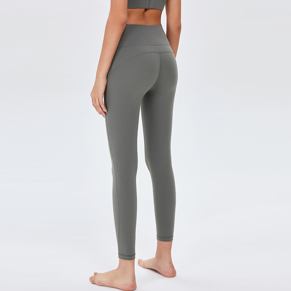 Pantalones de Yoga de cintura alta desnuda europea y americana de las mujeres Peach Hip lifting Pantalones deportivos ajustados pantalones de fitness de secado rápido