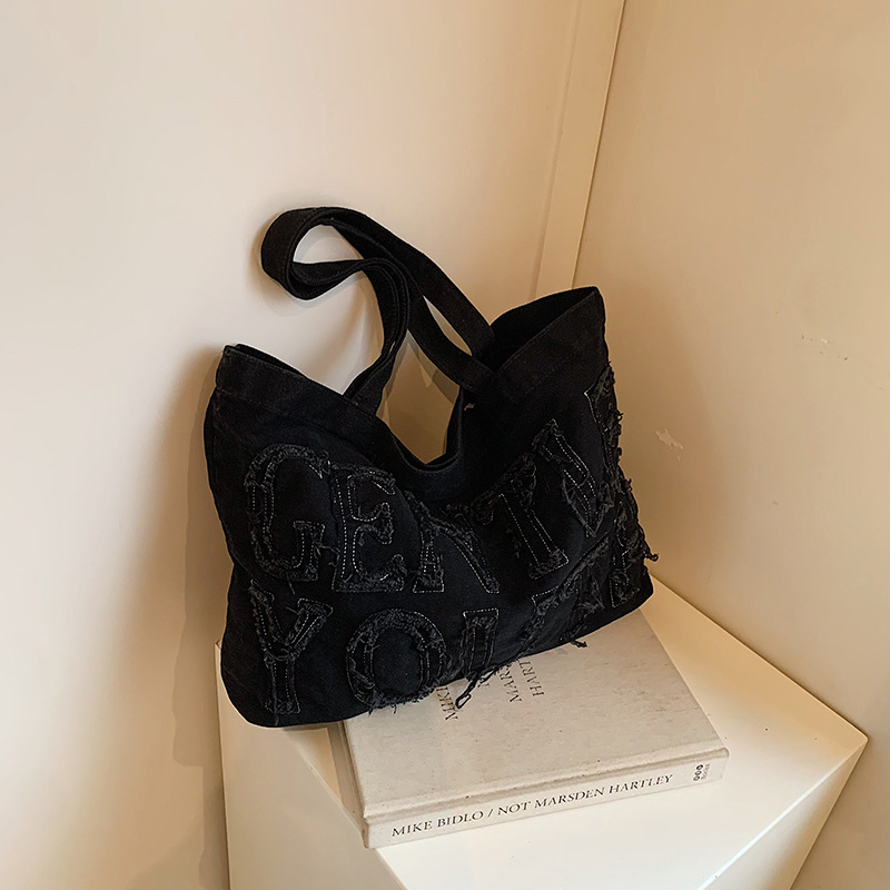 Nueva mochila de hombro de mezclilla retro, bolso de lona con letras de ocio, bolso de viaje artístico para estudiantes