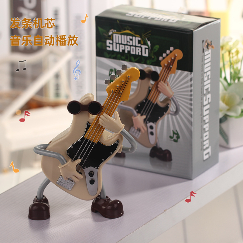 Creativo nueva guitarra muñeca caja de música oscilación automática decoración de escritorio caja de música de dibujos animados regalo de vacaciones al por mayor