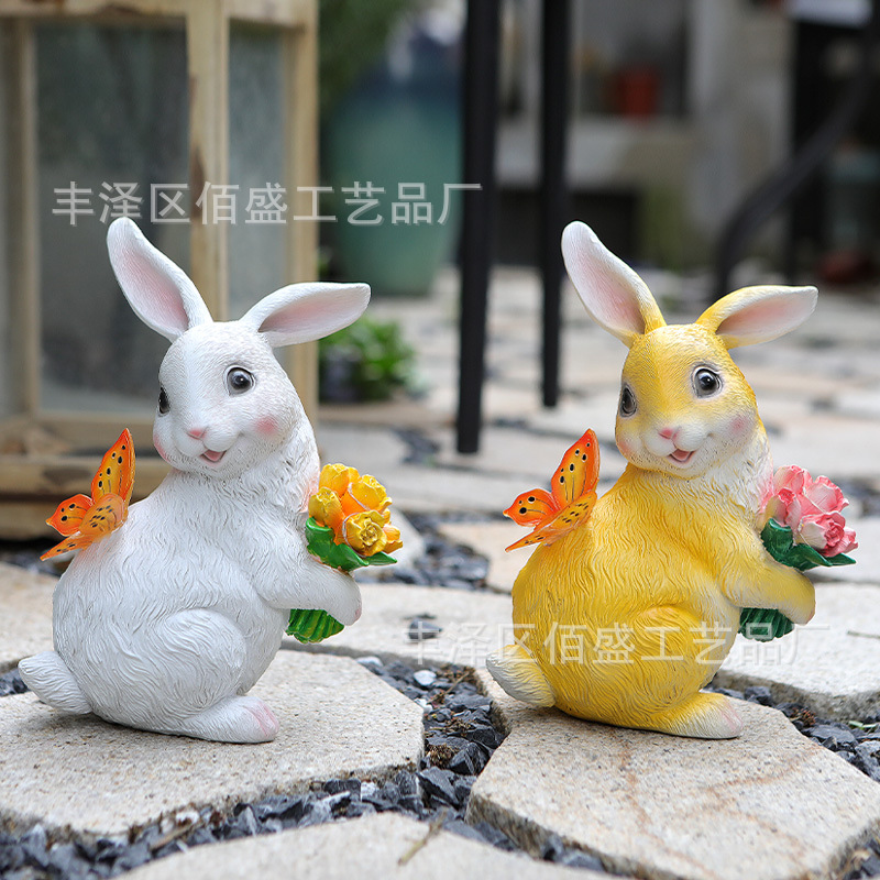 Decoración de jardín transfronteriza abraza flores mariposas conejos adornos animales al aire libre lámpara solar artesanías de resina