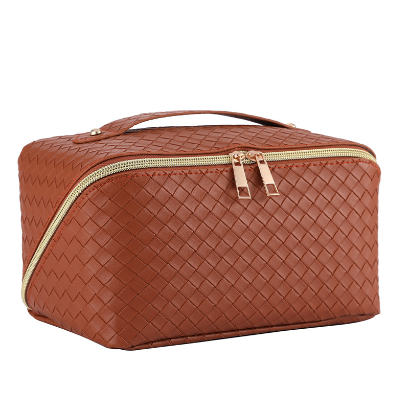 Bolsa de cosméticos de almohada tejida transfronteriza bolsa de almacenamiento de viaje portátil de gran capacidad portátil de cuero