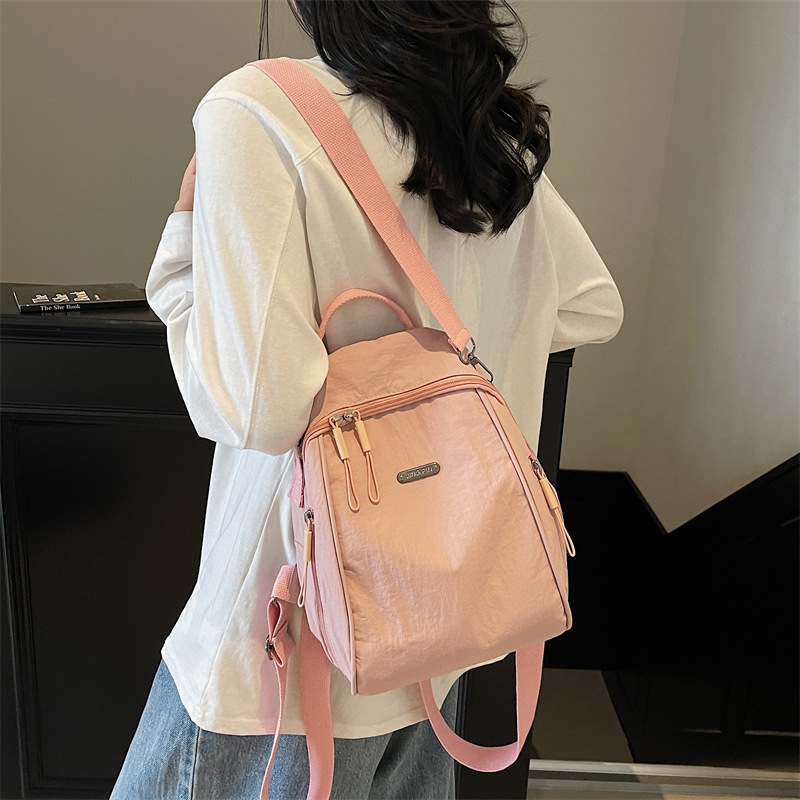 2025 nueva moda femenina versátil mochila de viaje mochila de hombro de viaje simple mochila ligera de gran capacidad