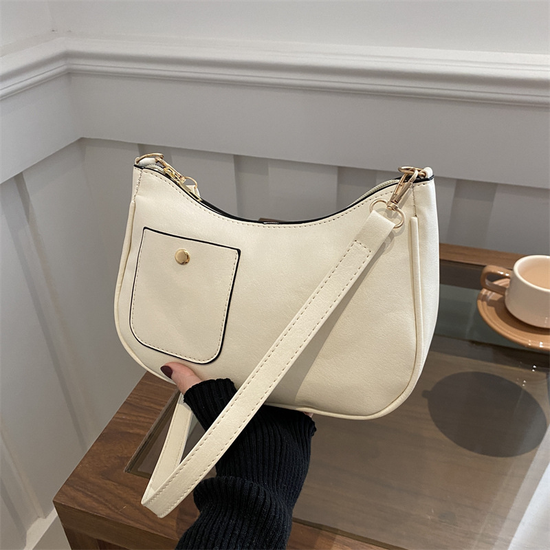 Bolso de mujer retro coreano personalidad 2025 bolso de media luna de hombro de estilo nuevo estilo francés bolso de diseño de nicho bajo la axila