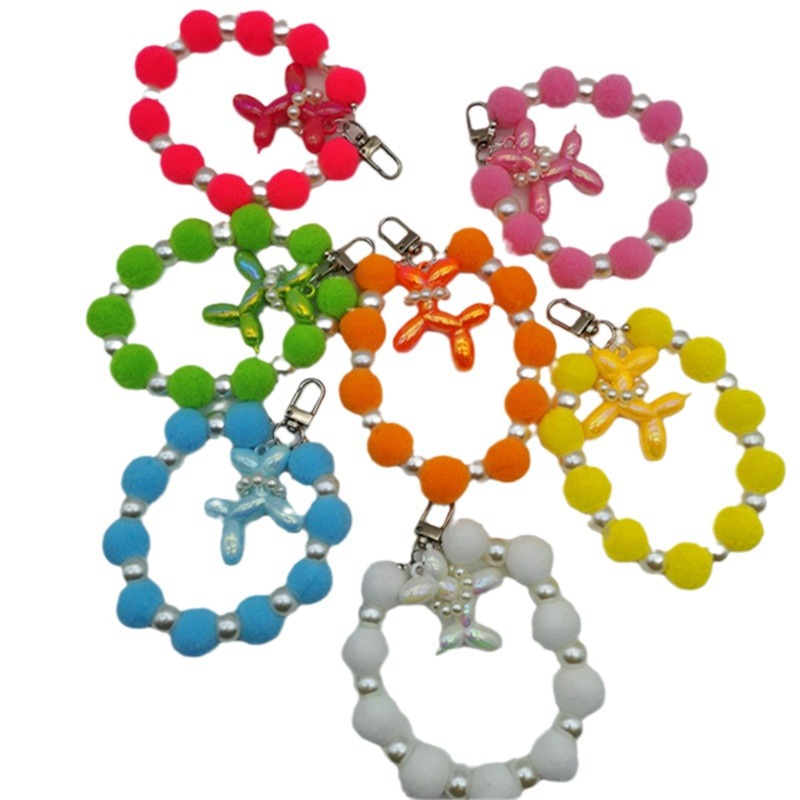 Nueva Bola de piel de cadena de perlas colgante Cadena de teléfono móvil ins Internet celebridad mismo estilo muñeca de invierno pulsera peluda cadena portátil