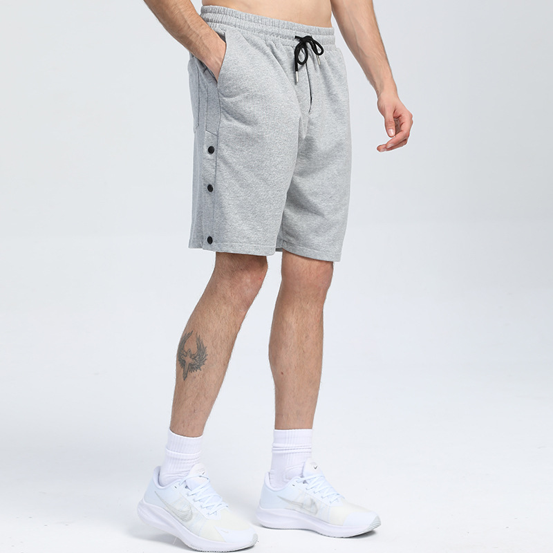 Pantalones cortos deportivos de algodón con botones de color sólido pantalones deportivos de verano transfronterizos de los hombres venta caliente tablero ligero pantalones de fitness que absorben el sudor pantalones de entrenamiento para correr