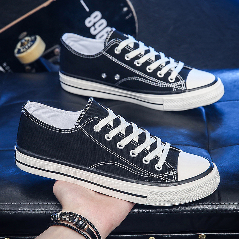Zapatillas de lona a la moda 2025 para hombre, calzado casual para parejas, zapatillas juveniles, transpirables, suministro del fabricante, cómodas, de suela plana, versátiles.