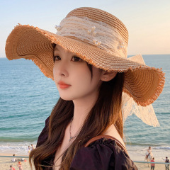 帽子の大きい蝶結びの日よけの麦わら帽子の女性のファッションの甘い気質の大きい帽子の日よけの帽子の屋外の日よけの帽子の越境