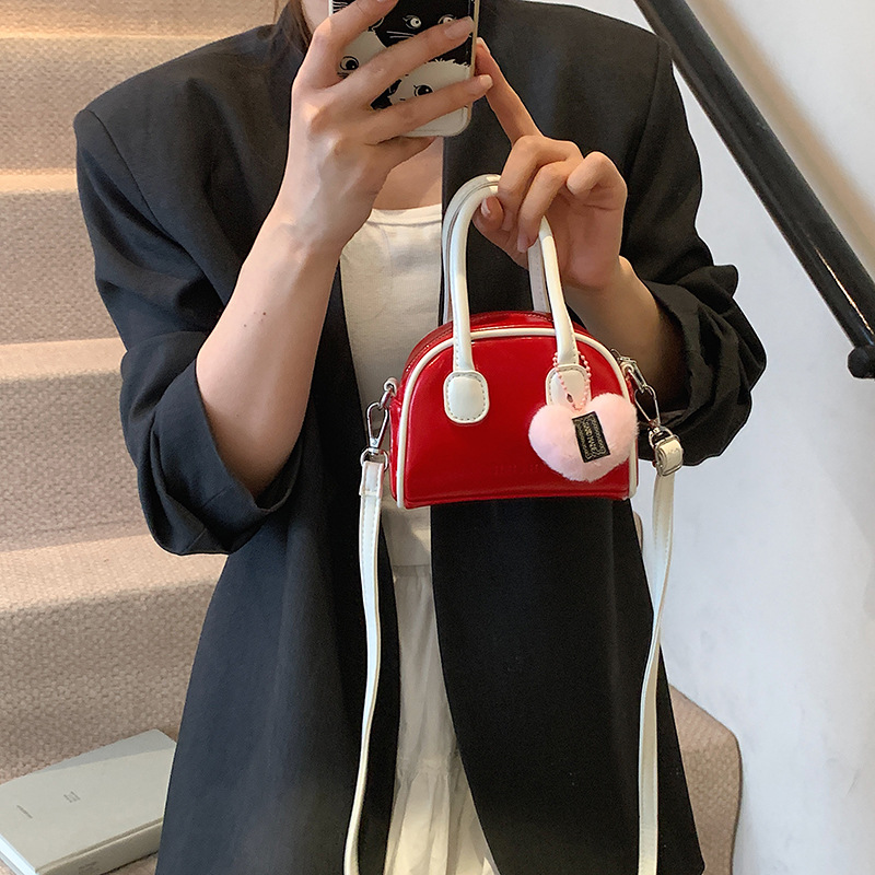 Bolsos coreanos para niños y niñas conchas de aire extranjero mini bolsos de mano de bebé de color sólido dulces bolsos para niños colgantes