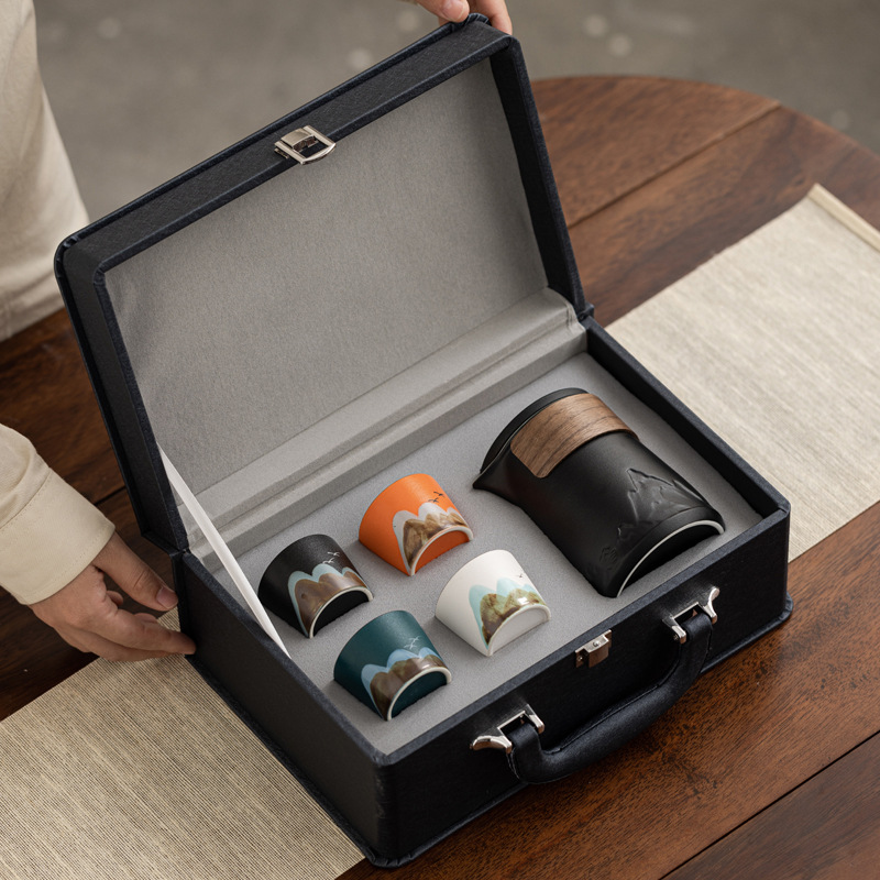 Conjunto de té de viaje de cerámica de estilo chino regalos de negocios de talla de taza de marca regalo de mano de empresa estatal bienestar