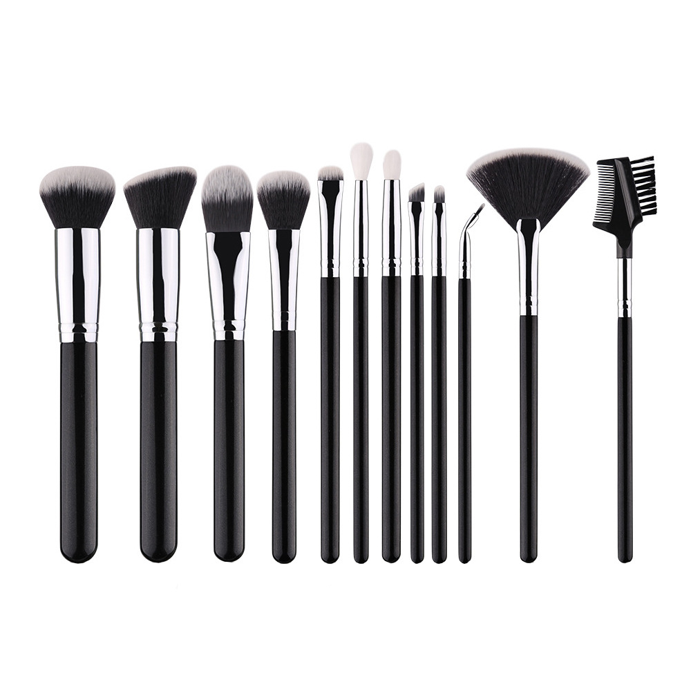 Zhuolya transfronteriza negro Mango de madera herramientas de belleza polvo suelto sombra de ojos cepillo de labios traje 12 pinceles de maquillaje conjunto completo venta al por mayor