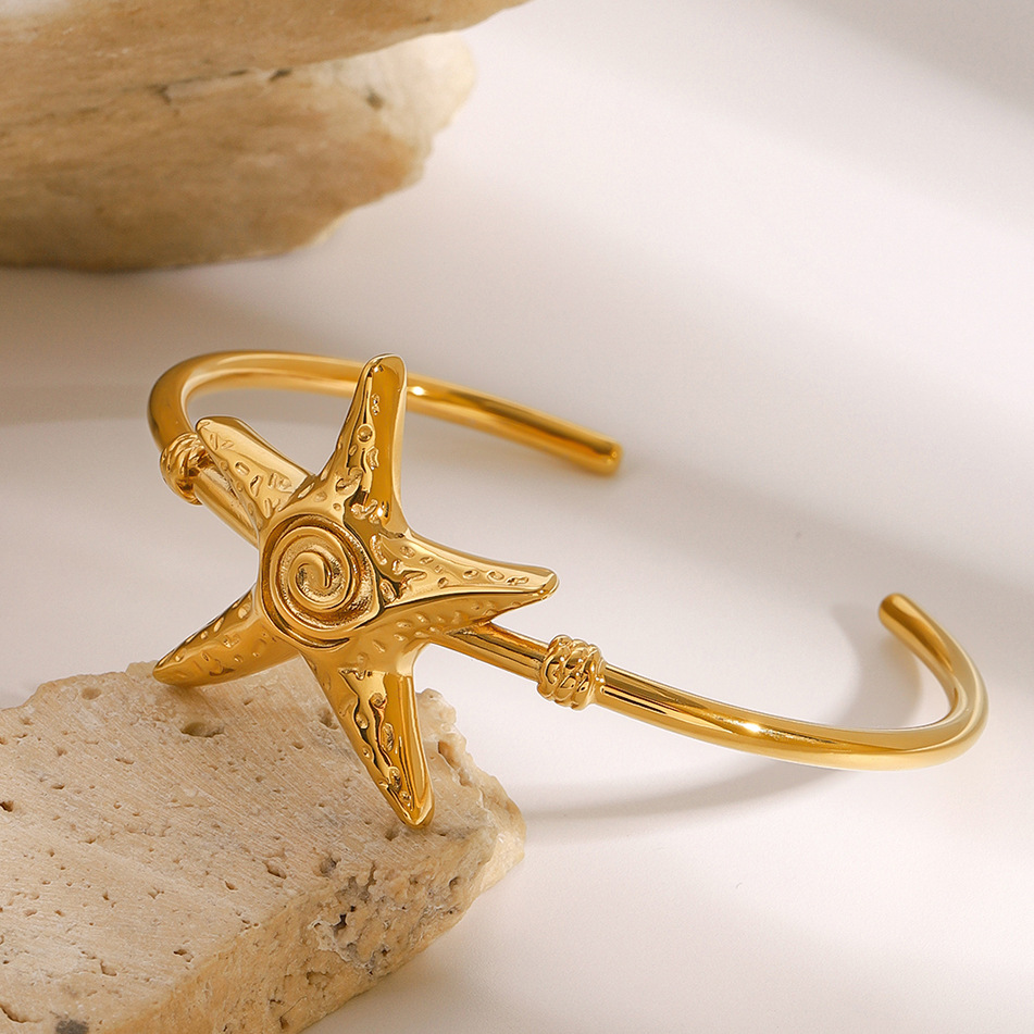 Jieding Europa y América Pulsera abierta de estrella de mar de acero inoxidable Pulsera de océano de sentido avanzado Pulsera de acero de titanio Bracelet transfronterizo