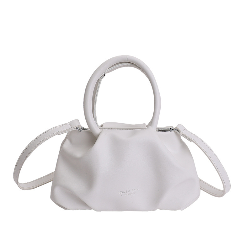 Alta sensación de mano pliegueada nube bolso de cubo para mujeres 2026 nuevo nicho de lujo ligero de moda perla bolsa de mochila