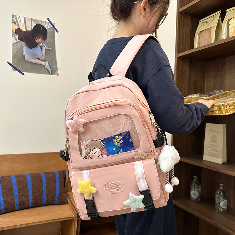 Mochilas escolares de moda bolsos de hombro para niñas estudiantes de primaria y secundaria sencillos paños transfronterizos ligeros bolsos de mano al por mayor bolsos de gran capacidad