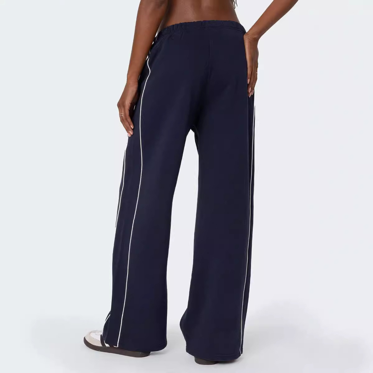 Europa y los Estados Unidos transfronterizos otoño y invierno personalidad callejera mujer blanco contraste rayas laterales casuales cintura elástica pantalones deportivos rectos