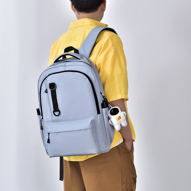 Nueva mochila coreana para hombres y mujeres, mochila de estudiantes a cuadrícula japonesa, pareja casual, mochila de viaje de moda de gran capacidad