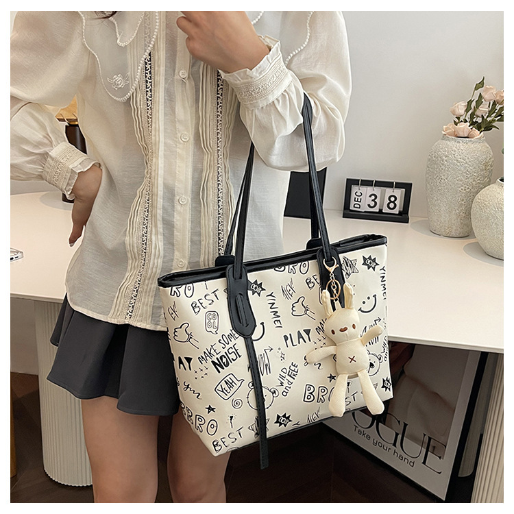 Bolso grande bolso de mujer 2025 nuevo lindo cartón pu bolso de hombro con cremallera de moda bolsa de otoño / invierno bolso de mujer