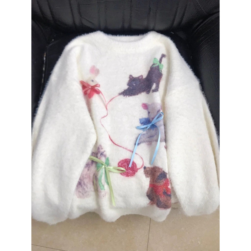 Small knitted demi-season cute sweater with bow