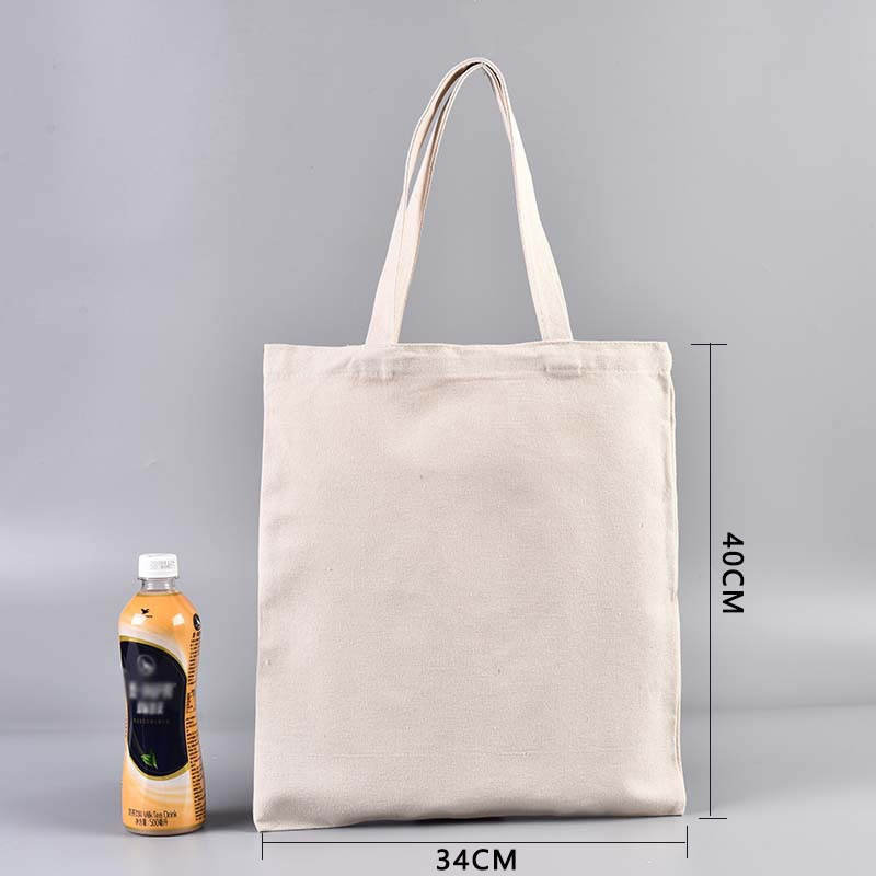 En stock bolsa de lona portátil en blanco personalizable logotipo de impresión en color de un solo hombro bolsa de compras bolsa de algodón de entrenamiento publicitario