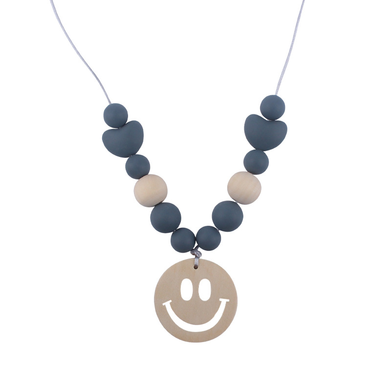 Nuevo bebé suministros smiley cara mordedor collar bebé cuentas de silicona mordida molar masticable colgante collar