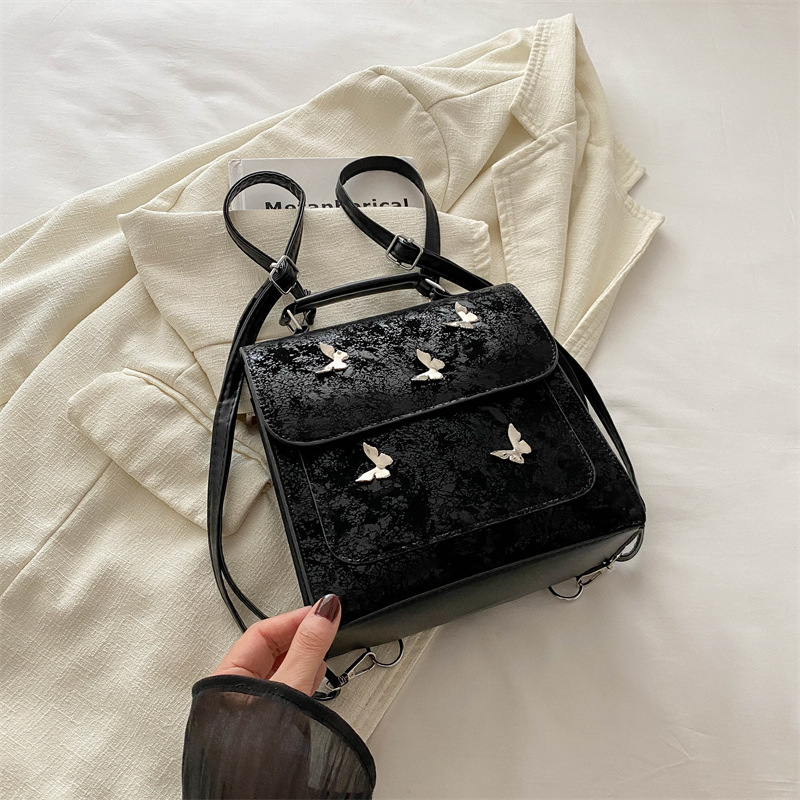 Mochila de mujer casual de estilo exterior versátil 2024 verano nuevo viaje de alta calidad mariposa mini mochila