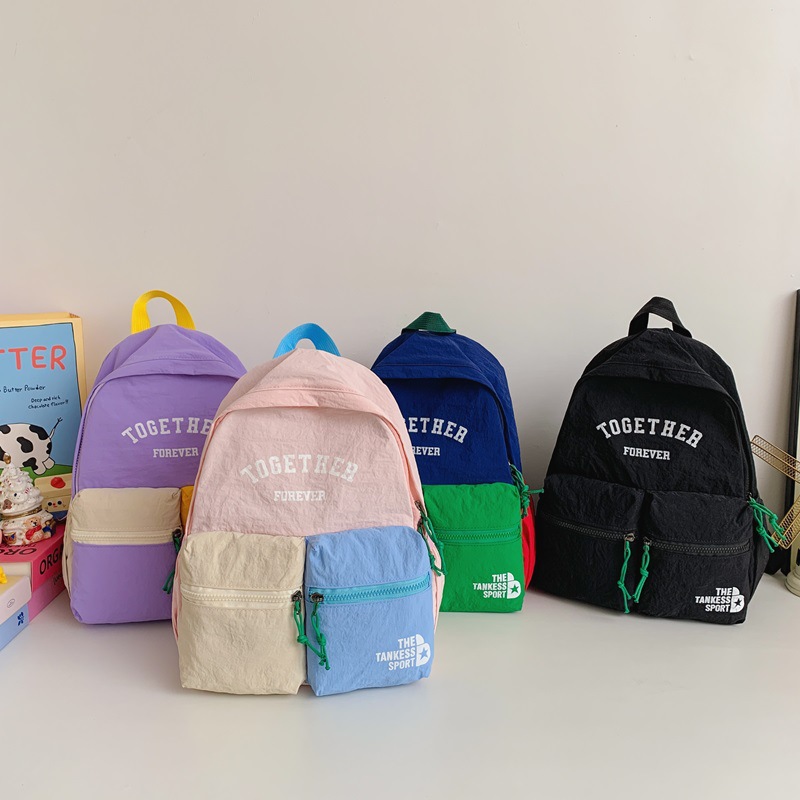 Mochila de estilo coreano para niños y niñas con color contrastante. Mochila de estudiantes de escuela primaria con letras extranjeras de gran capacidad. Mochila para padres e hijos.