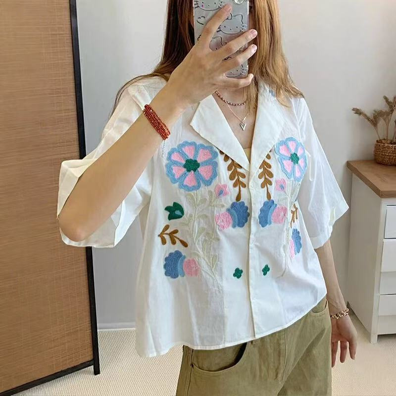 French Niche 2025 Summer New Sweet Age-reducing Childhood Embroidered Cute Flower Lap Collar Loose Cotton Shirt French Niche 2025 Summer New Sweet Age-reducing Childhood Embroidered Cute Flower Lap Collar Loose Cotton Shirt