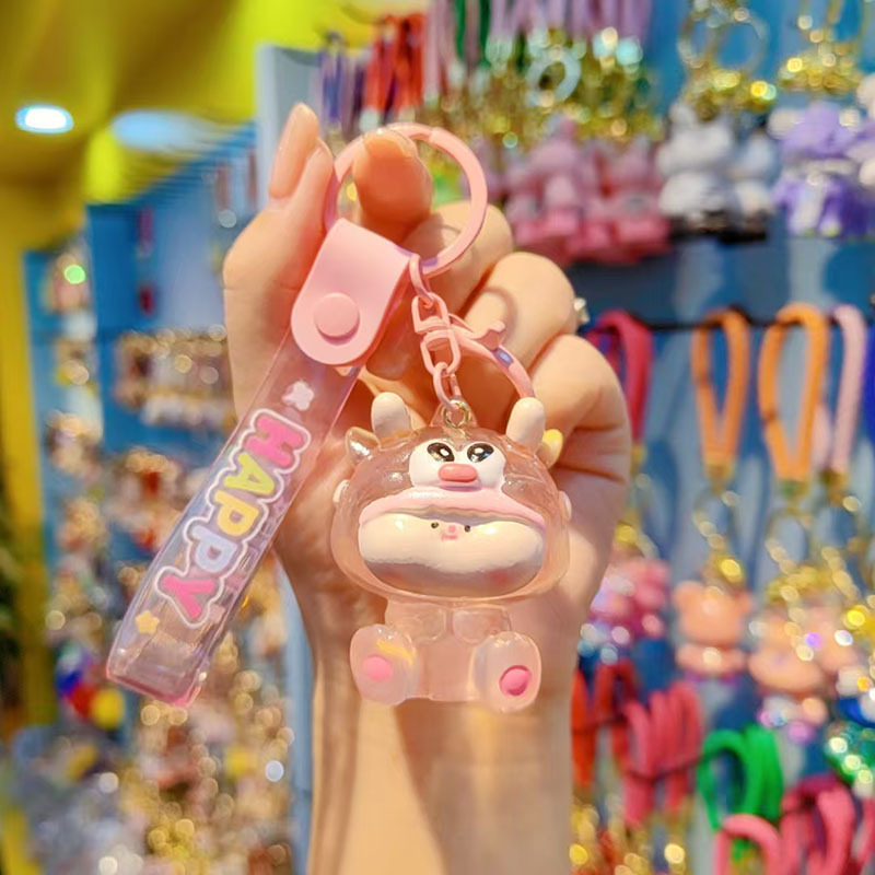 Caricatura Lilith dragón lindos colgantes de resina transparente bolsos de automóviles colgantes de llaves al por mayor