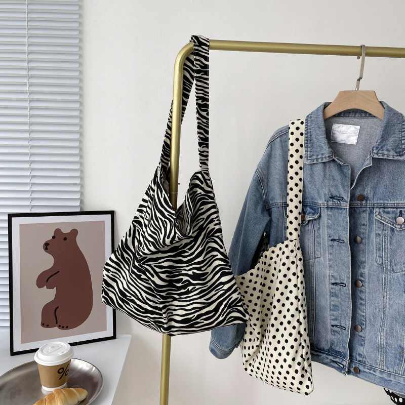 Diseño nicho bolsas de lona para mujeres 2025 nueva gran capacidad coreana estampado de leopardo flor de hombro impresa bolsas de mujer