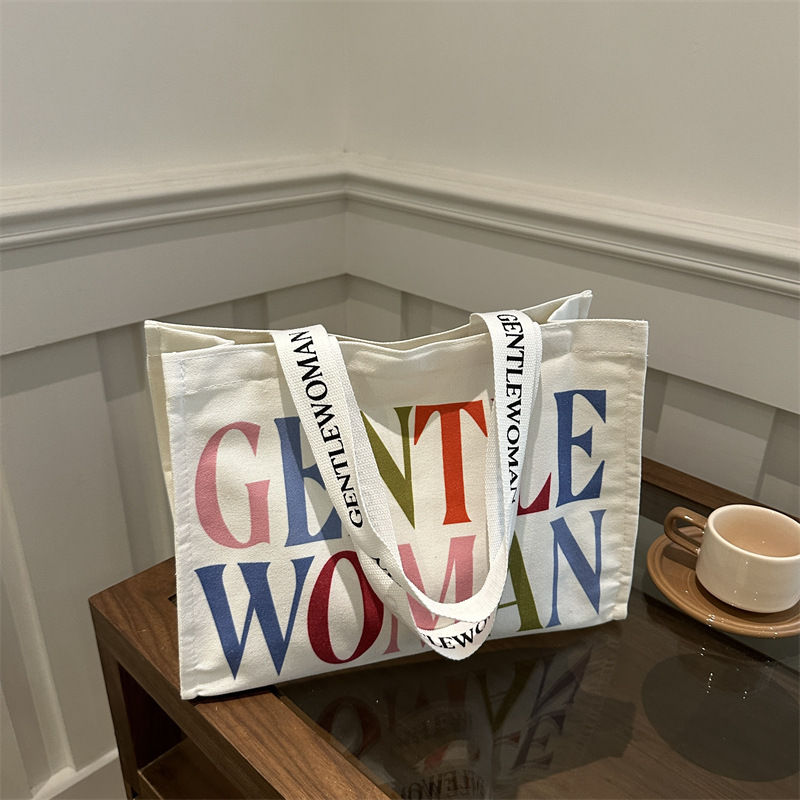 Personalidad simple impresión de letras bolsos de lona portátiles 2024 nuevo invierno literatura tote bolsos de hombro de moda