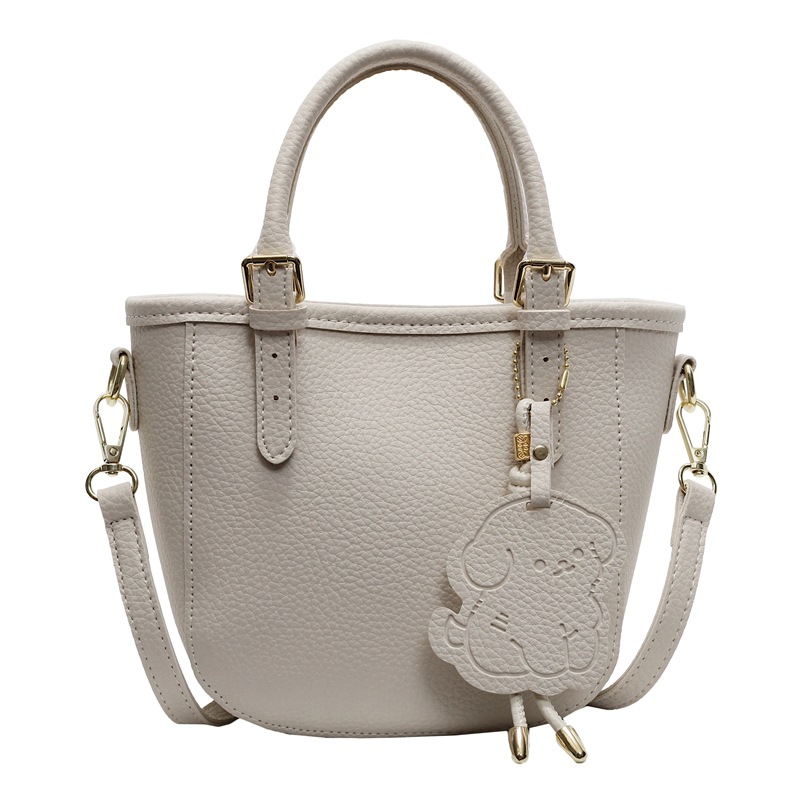 Bolsa de cubo portátil de comercio exterior 2025 nuevo bolso de mochila de textura universal nicho de diseño de red de popularidad explosiva bolso de hombro