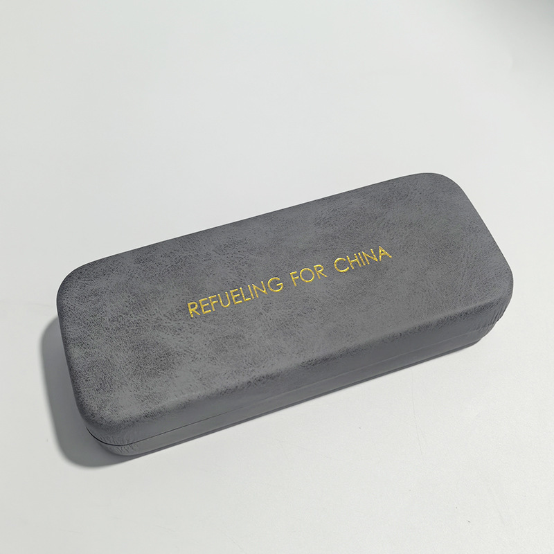 2026 nueva caja de gafas de sol de moda de cuero de dos colores bolsa blando miopía caja de ojos conjunto completo de bolsa de espejo tela