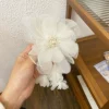 White hairgrip with tassels, flowered