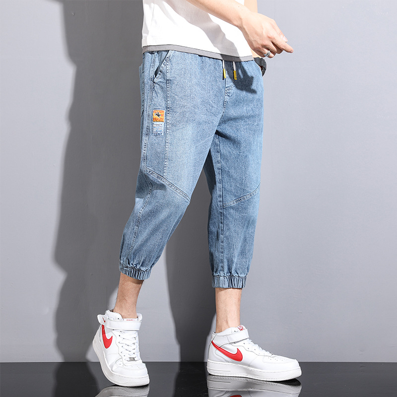 Comercio exterior cortar la etiqueta ropa de hombre suelta pie abrazado siete puntos jeans cintura elástica cuerda de dibujo de verano juvenil ocio pantalones harun moda