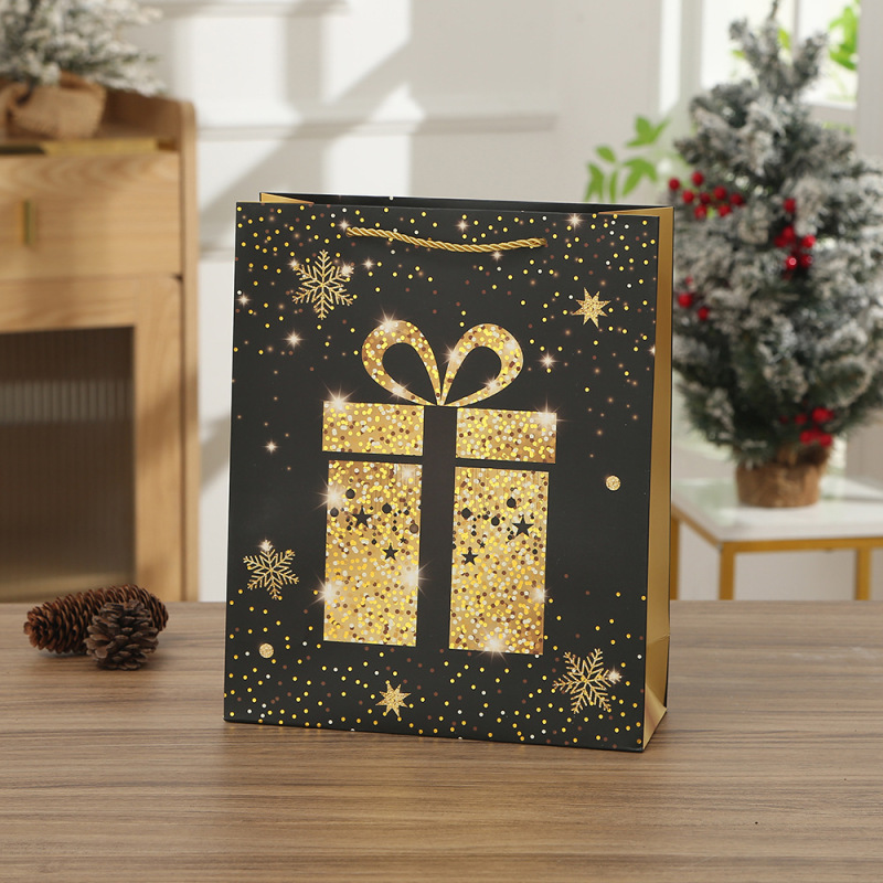 黒金のテーマのギフトバッグのクリスマスは縄の手提げ袋のクリスマスイブのサプライズのプレゼント袋の手提げ袋のショッピングバッグを着ます。|undefined