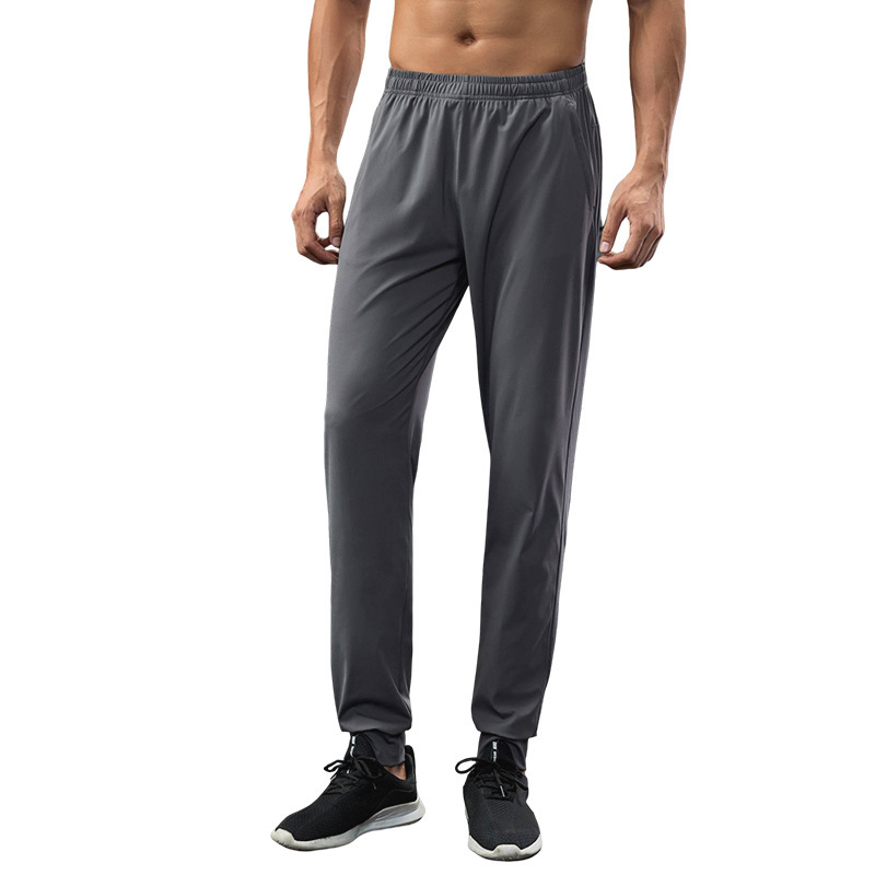 Fábrica de fuerza para correr pantalones deportivos de otoño elásticos rápidamente secos pantalones elásticos transpirables ociosos pantalones de pie delgados