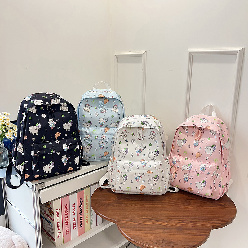 Mochila de graffiti de dibujos animados ligera, mochila de gran capacidad japonesa, mochila de estudiantes de escuela secundaria pequeña y fresca.