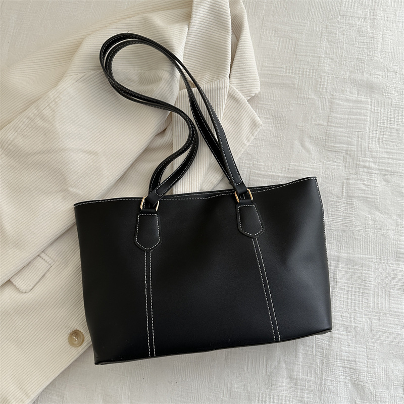 Bolso de viaje de alta gama retro 2025 primavera nuevo estilo salvaje ins color sólido bolso de hombro de trabajo bolso Tote