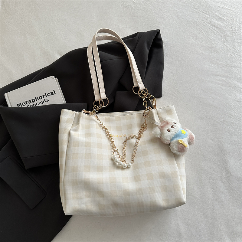 Bolsa de alto valor reticular para mujeres 2026 primavera y verano nuevo paquete de viaje de hombro universal bolso de nicho en línea bolsa de mujer