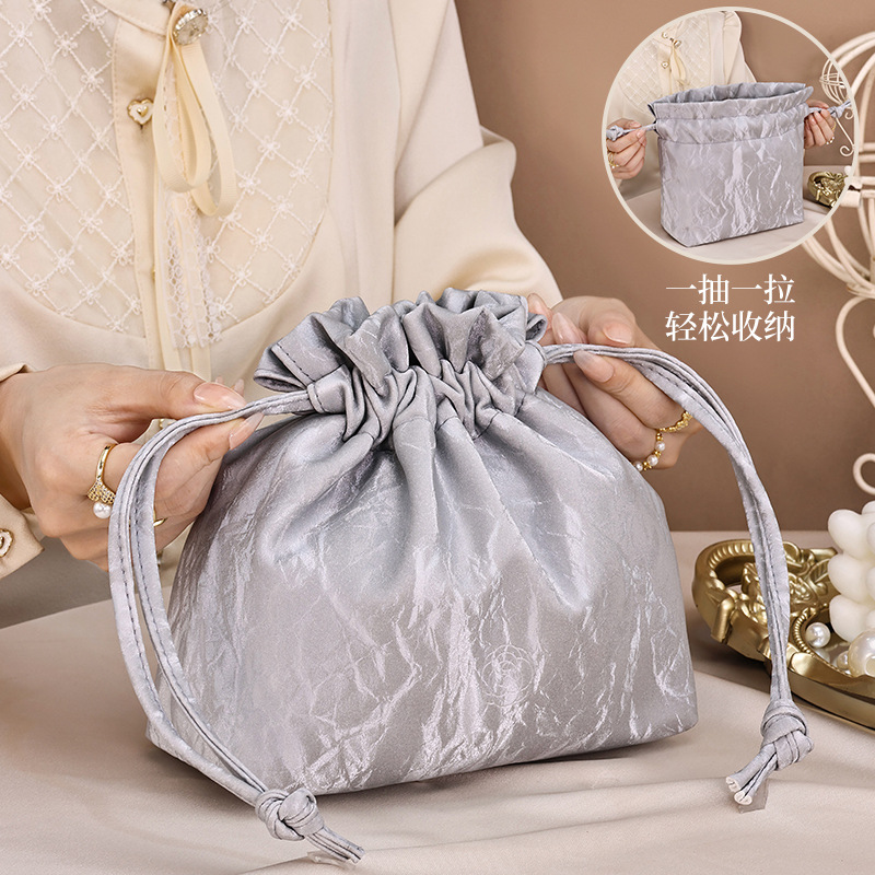 Nueva bolsa de almacenamiento portátil francesa de alto valor facial cosméticos de gran capacidad portable perezoso clásico arena flotante