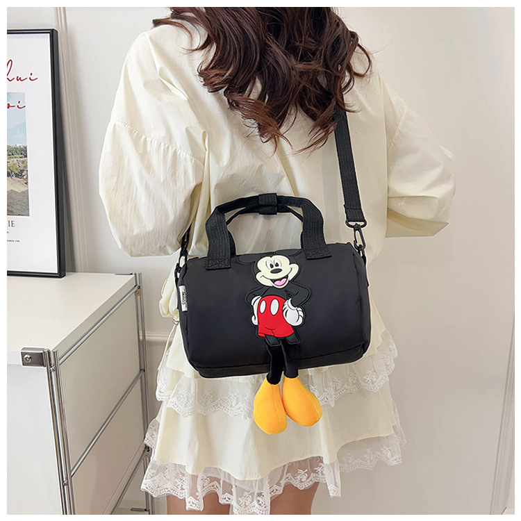 The 2021 new children's bags feature a cute Mickey Mouse pattern bowling bag for girls and a fashionable hand-held shoulder bag undefined