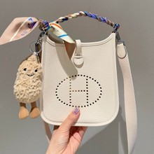 伊芙琳包包女真皮斜挎包高级质感头层牛皮水桶包镂空荔枝纹单肩包