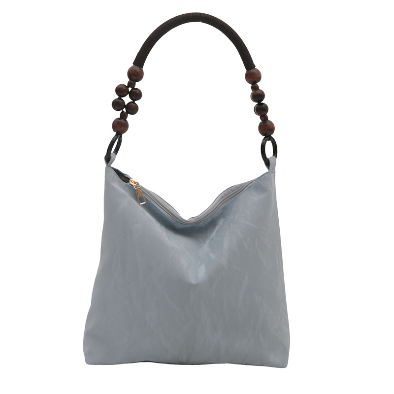 Nueva bolsa de estilo chino para mujeres 2024 verano nuevo estilo simple de moda seda bolso inferior nicho universal bolso de hombro casual