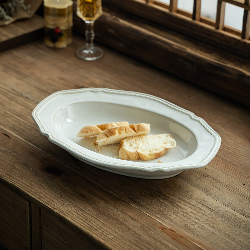 Cerámica retro francesa en relieve de alta calidad, platos de comida occidentales, platos de pescado al vapor, platos de ensalada de frutas, platos al por mayor