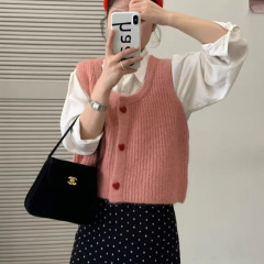 韓国系の小清新で甘い愛のカーディガンのニットのベストの女性の春秋の新型のカジュアルな重ね着のセーターの肩