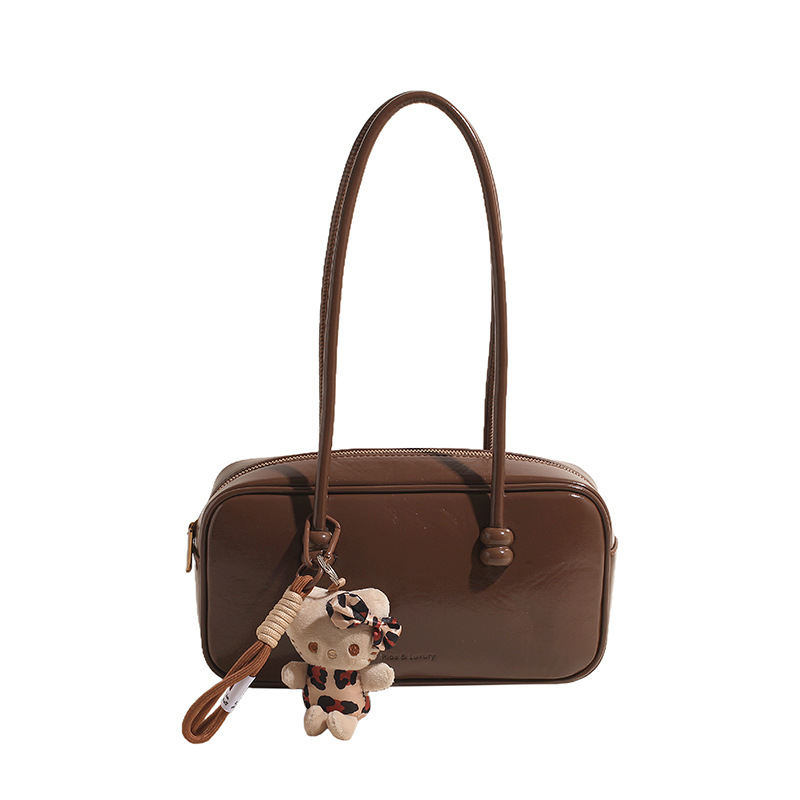 Bolsa de bolos portátil retro simple para mujeres otoño / invierno 2025 nueva bolsa de almohada casual para viajar bolsas de hombro y axila